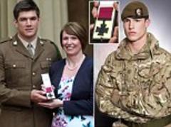 Ultimate tribute to a selfless hero: Parents of British soldier killed while protecting his comrades in Afghanistan accept his posthumous Victoria Cross from the Queen